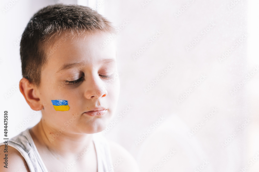 frustrated poor boy protests against the military conflict, cries, worries and is afraid. The crisis. World peace. frustrated poor boy protests against the military conflict, cries, worries and is afraid. The crisis. World peace.