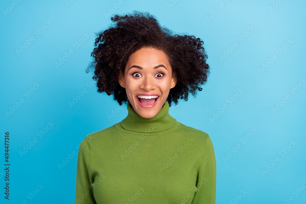 Photo of astonished positive person open mouth impressed face grimace look camera isolated on blue color background Photo of astonished positive person open mouth impressed face grimace look camera isolated on blue color background