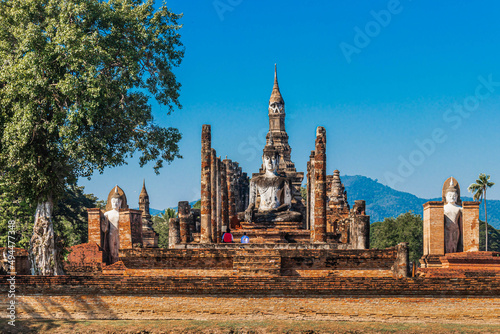 Obraz na płótnie Closeup of Buddha statue in the ancient ruins of Sukhothai temple in Thailand
