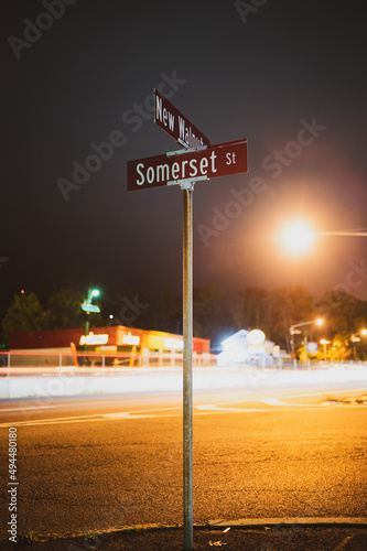 Vertical shot of traffic signs in New Jersey at night photo