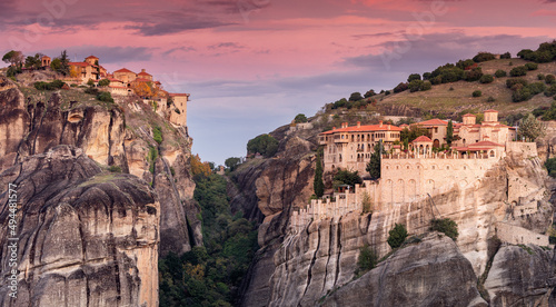 Panoramic scenic view of the famous Meteora flying monasteries in Greece at sunrise. A journey to the wonders of the world. Visit tourist attractions and landmarks