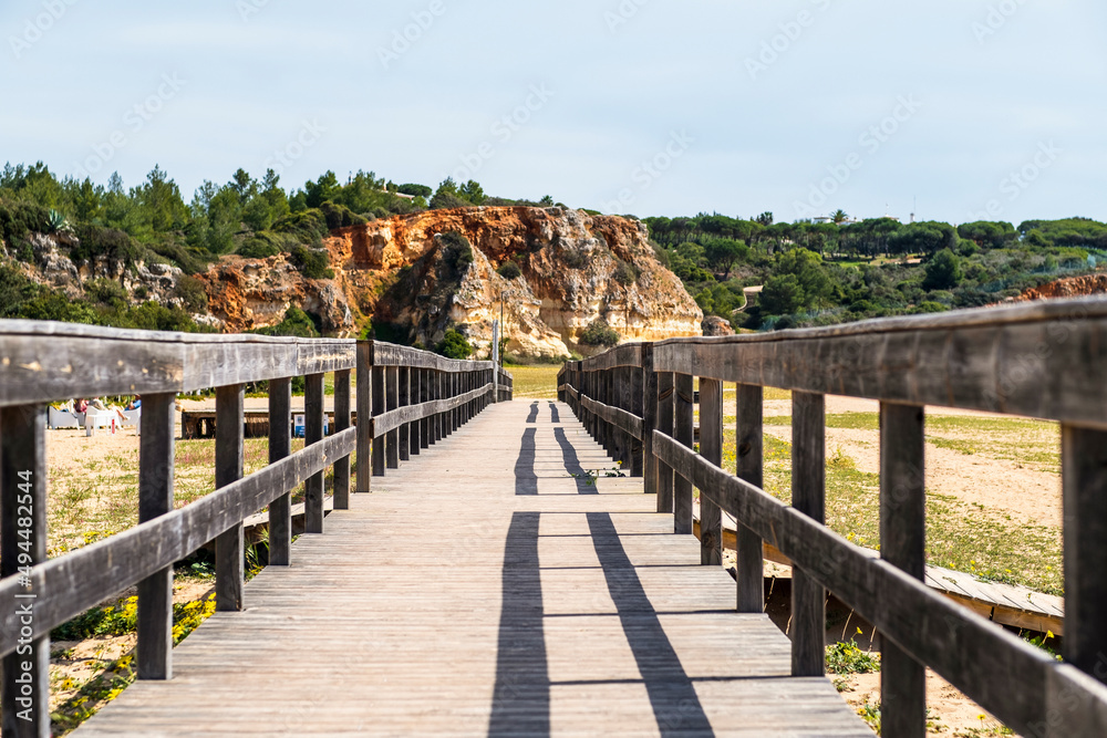 Wooden bridge on the beach of Ferragudo, Algarve, Portugal