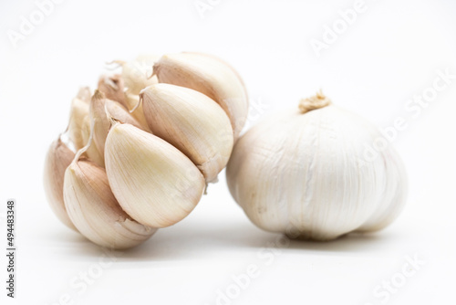 Isolated garlic.. Fresh peeled garlic cloves, bulb with garlic slices isolated on white background. clipping path
