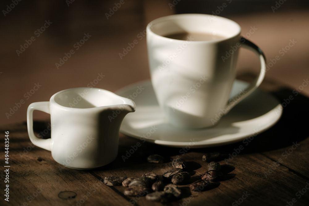 Cup of coffee and chocolate beans Cup of coffee and chocolate beans