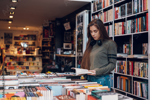 Woman buying books at a bookstore
