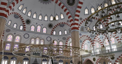 Accra Ghana National Mosque inside Muslim Islam pan tilt. Open in 2021. Replica of the Blue Mosque or Sultan Ahmed Mosque in Istanbul Turkey. Prayer reading the Quran or Koran. Islam religion.