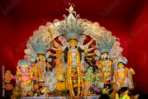 Quadro su tela Goddess Durga idol at decorated Durga Puja pandal, shot at colored light, at Kolkata, West Bengal, India