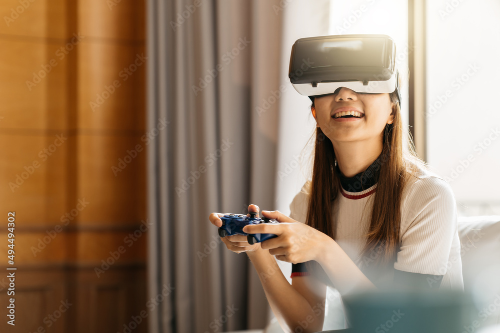 Woman play the video game with virtual reality device Woman play the video game with virtual reality device