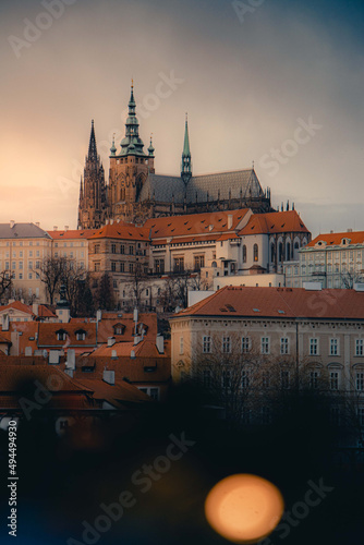 Fotografie Vertical shot of old european houses and gothic prague castle, Czech republic