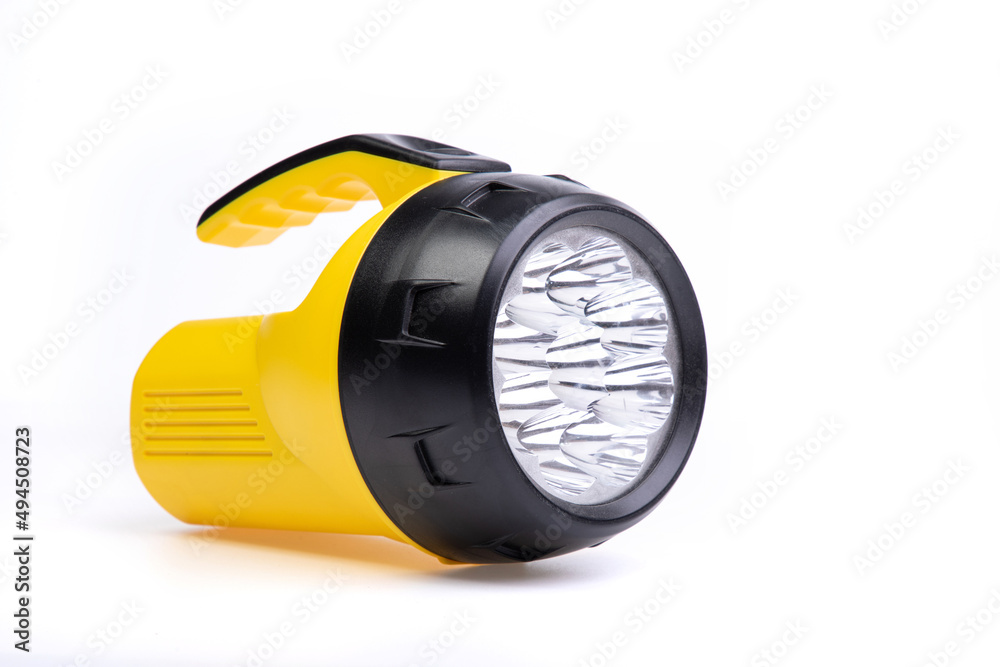yellow and black flashlight on a white background yellow and black flashlight on a white background