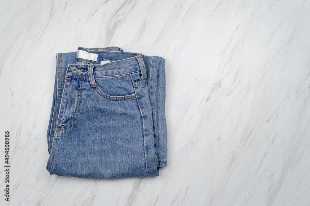 Top view, Blue jeans on white background. Top view, Blue jeans on white background.