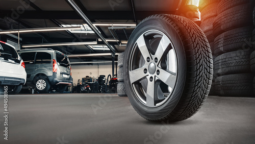 Obraz na plátně tire at repairing service garage background