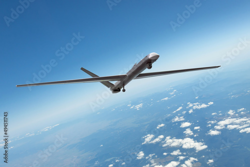 Unmanned military drone uav flying in the air, reconnaissance flight over the territory.