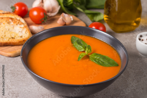 Tomato soup with basil. Healthy, vegan and dieting lunch and dinner concept. Gazpacho. 