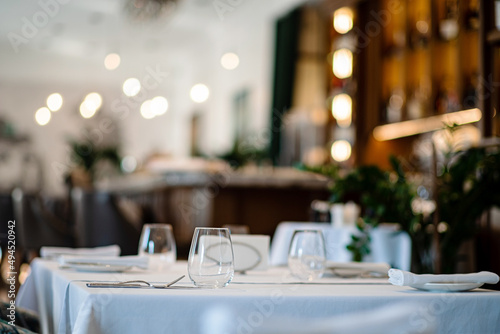 glasses on empty restaurant table in contemporary restaurant