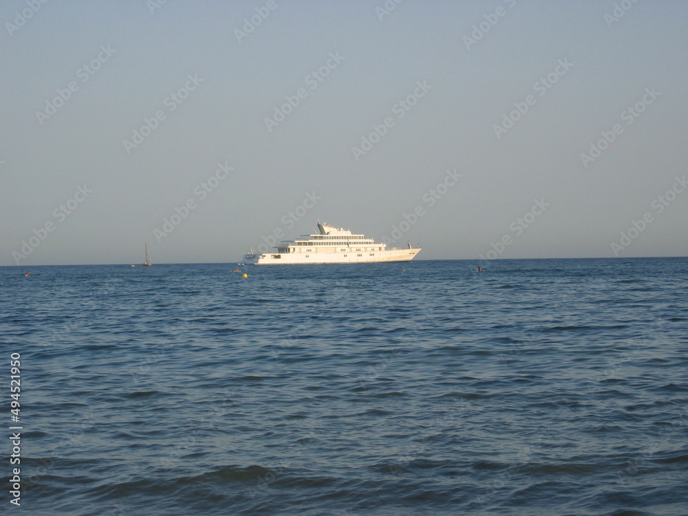Views from the beach of Benalmadena with yacht in the background, Costa del Sol, Malaga, Andalusia, Spain
