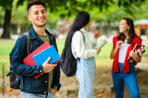 Fotografie Happy male student outdoor smiling