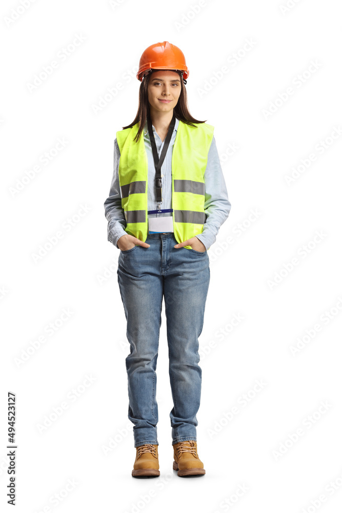Full length portrait of a young female site engineer with a safety vest and hardhat - obrazy, fototapety, plakaty 