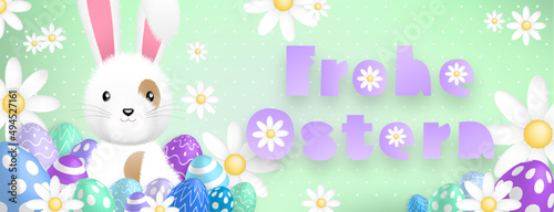 German purple text : Frohe Ostern, with a cute white rabbit behind colored eggs and flowers on a green background