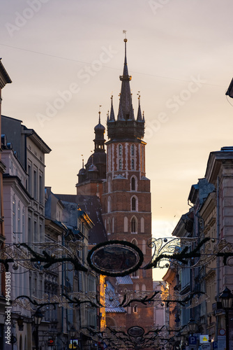 View of St. Mary Church from the main Florianska street in the old town of Krakow, Poland photo