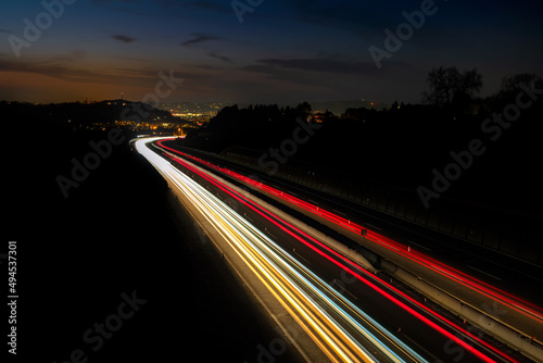 long exposure on the highway with streaks of light going towards the city
