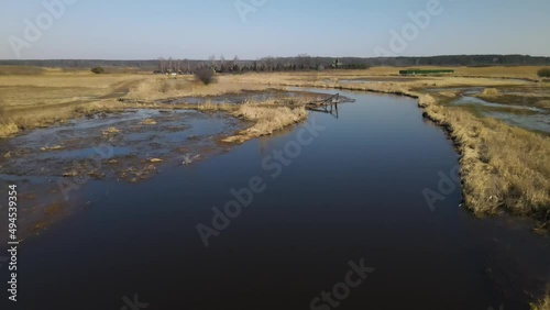 View of the Narew River and its backwater around the hermitage of Orthodox monks in Odrynki during the pre-spring thaws. photo