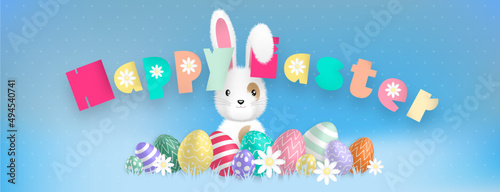 Happy Easter text with sweet colors, with a cute white bunny behind colored eggs and flowers on a blue background