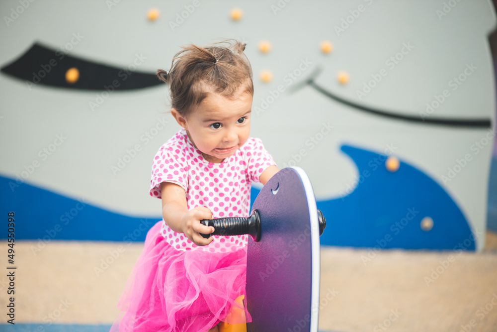 Fototapeta premium Portrait of cute little girl at playgoud