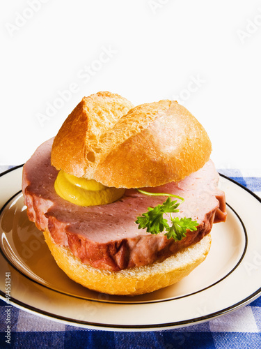 Close-up shot of Leberkase in a white plate on a white background photo