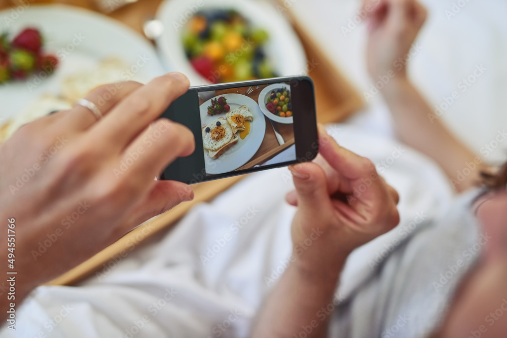 Look a this amazing breakfast youve made. PoV shot of an unrecognizable couple taking a photo of their breakfast that theyre having in bed during morning hours. Look a this amazing breakfast youve made. PoV shot of an unrecognizable couple taking a photo of their breakfast that theyre having in bed during morning hours.
