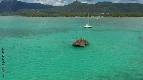 Aerial view of Ile aux benitiers Mauritius. Beautiful exotic island. Circle flight around Crystal rocks. photo