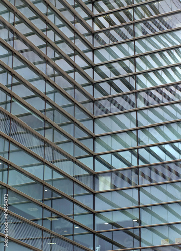 full frame modern urban office architectural abstract with geometric shapes and buildings reflected in blue glass windows