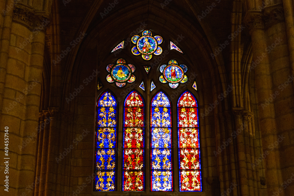 Old stone cathedral with beautiful rose windows.