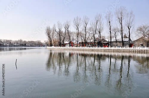 Houhai Lake with the reflection of buildings and trees in winter in Beijing, China photo