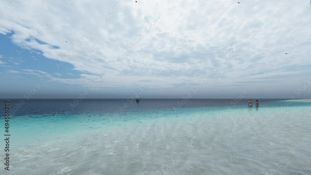 Blue ocean wood sand beach nature tropical palms Island. Hotel beach. Caribbean sea and sky. Small wild beach chairs. landscape Island. Palms turquoise sea background Atlantic ocean. 4K Video. Blue ocean wood sand beach nature tropical palms Island. Hotel beach. Caribbean sea and sky. Small wild beach chairs. landscape Island. Palms turquoise sea background Atlantic ocean. 4K Video.