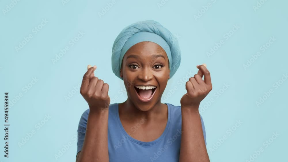 Cheerful African Lady Showing Heart Symbol Crossing Fingers, Blue Background Cheerful African Lady Showing Heart Symbol Crossing Fingers, Blue Background