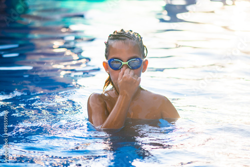 Portrait of a little swimer at the pool © tutye