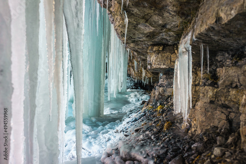 Chilling view of the frozen Vallesinella waterfall in Alto Adige, Italy photo