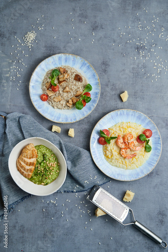 Three plates of risotto with different ingredients