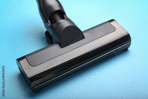Vacuum cleaner on blue background. Top view. Cleaning concept.