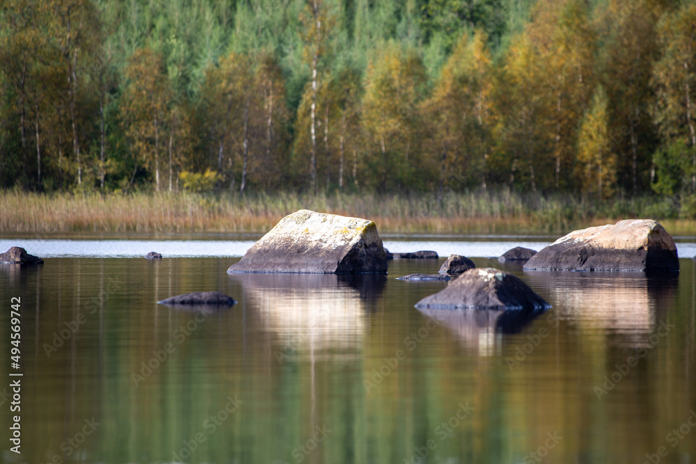 Naklejka premium Stones in lake
