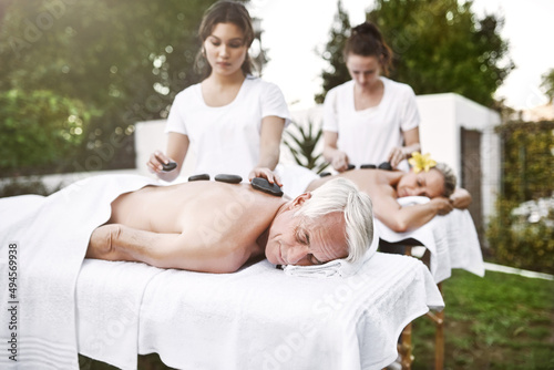 I hope this massage never ends. Shot of a middle aged couple having a relaxing massage together at a spa during the day.