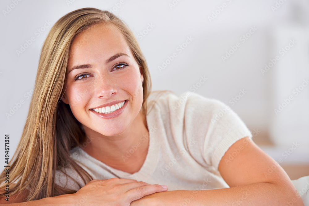 Spending the day at home. Portrait of an attractive young woman relaxing at home. Spending the day at home. Portrait of an attractive young woman relaxing at home.