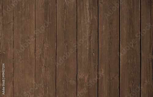 Natural Brown Wooden Background. Wooden rustic background. Old boards. Copy space for your text or image. Top view. Dark brown wood boards. Blank for design and require a wood grain. Vertical.
