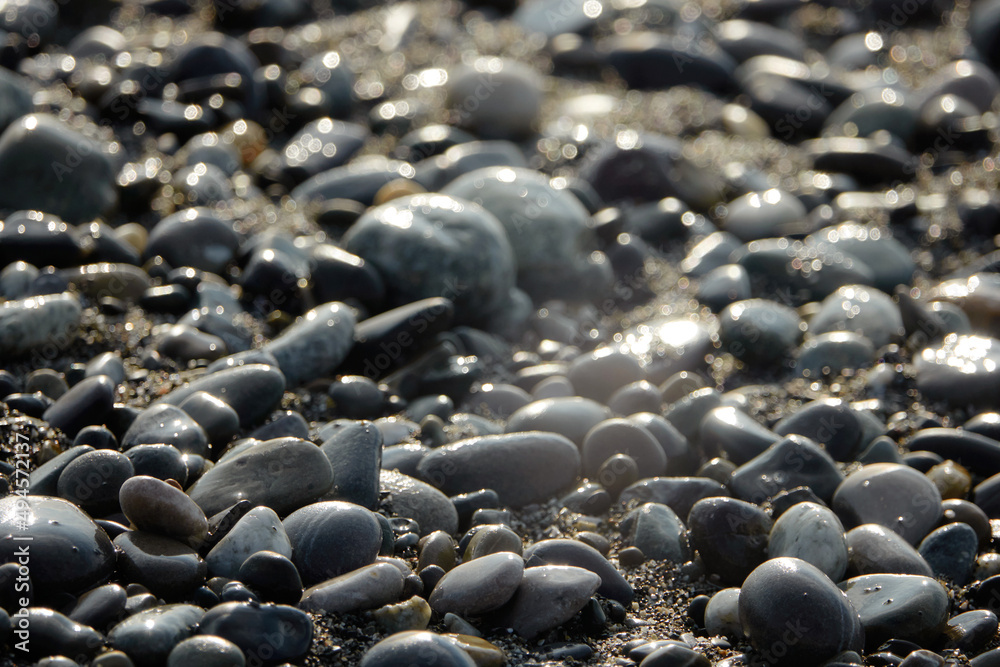 Sea pebbles. Small stones texture. Color stone in abstract background. Sea pebbles. Small stones texture. Color stone in abstract background.
