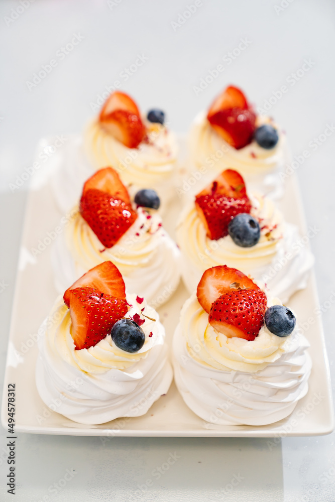strawberries, blueberries and cream decorates to Anna Pavlova cakes. strawberries, blueberries and cream decorates to Anna Pavlova cakes.