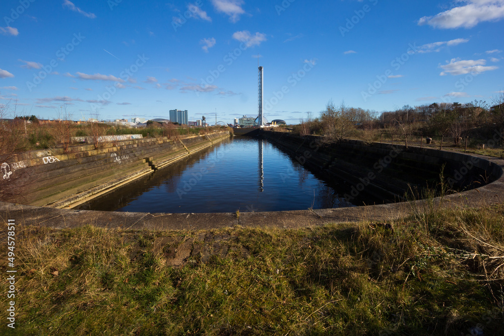 The post industrial, old ship building docks on the river Clyde on a clear spring morning 