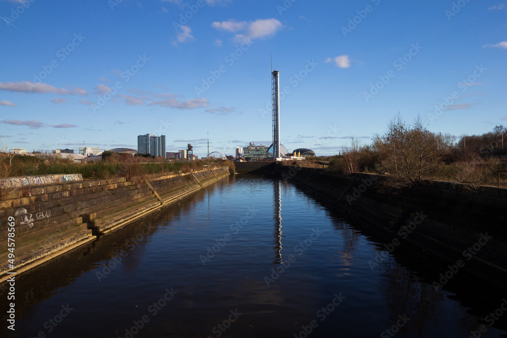 The post industrial, old ship building docks on the river Clyde on a clear spring morning 