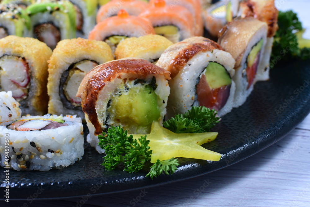 Traditional colorful suhi, cream cheese, salmon, caviar, rool sishi crunch, sesame seeds and sauce Traditional colorful suhi, cream cheese, salmon, caviar, rool sishi crunch, sesame seeds and sauce