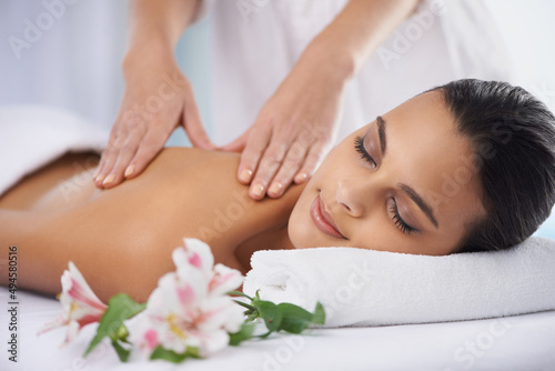 It doesnt get anymore relaxing.... Cropped shot of a beautiful young woman relaxing during spa treatment.